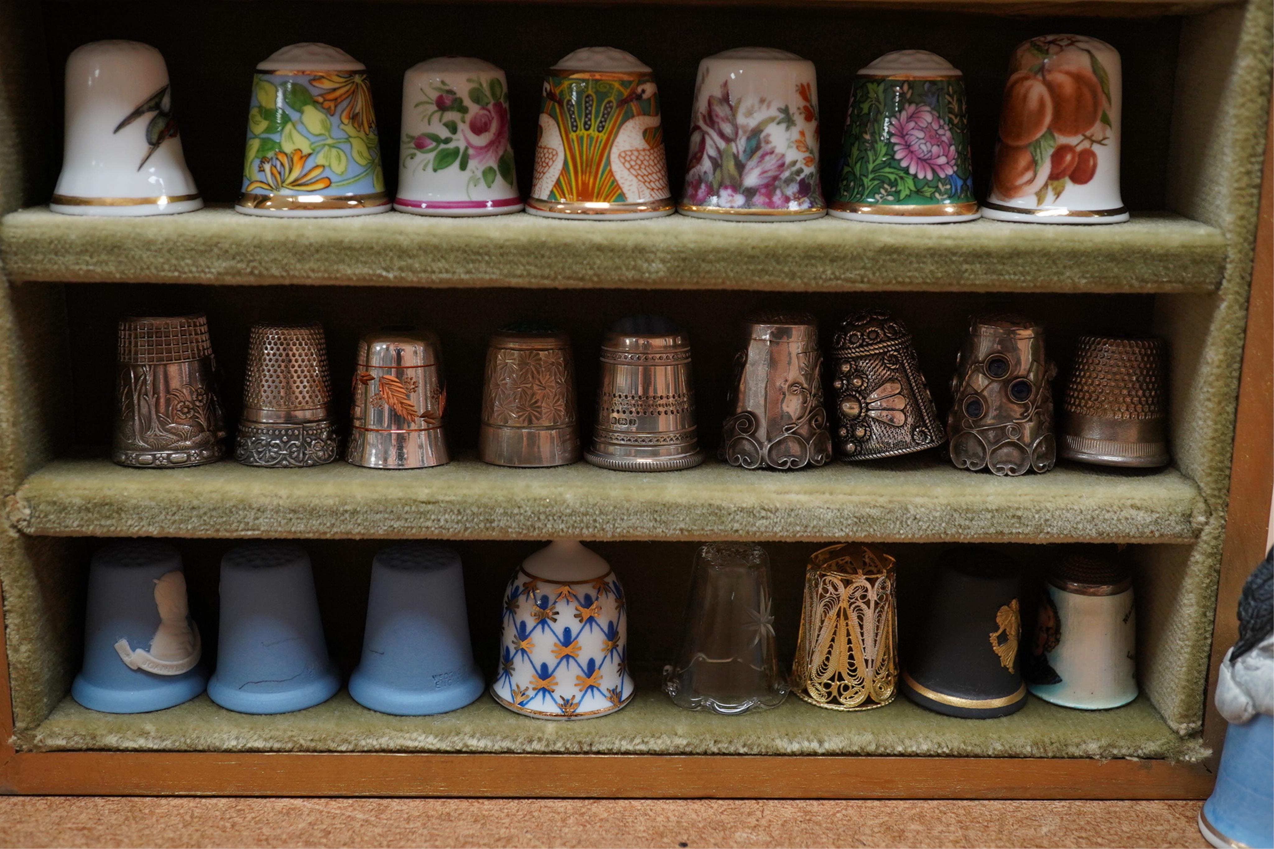 A collection of decorative thimbles, some silver. Condition - good